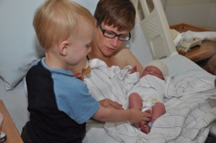 Amy introduces her older son Anderson to new baby Alex